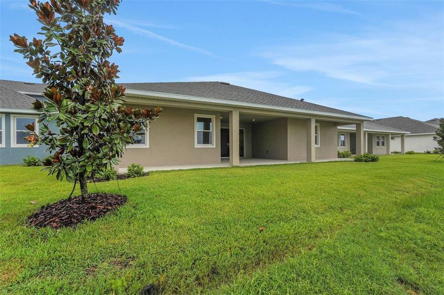 Front exterior of a new home in Seaire, Parrish, FL, highlighting curb appeal (Image 20).