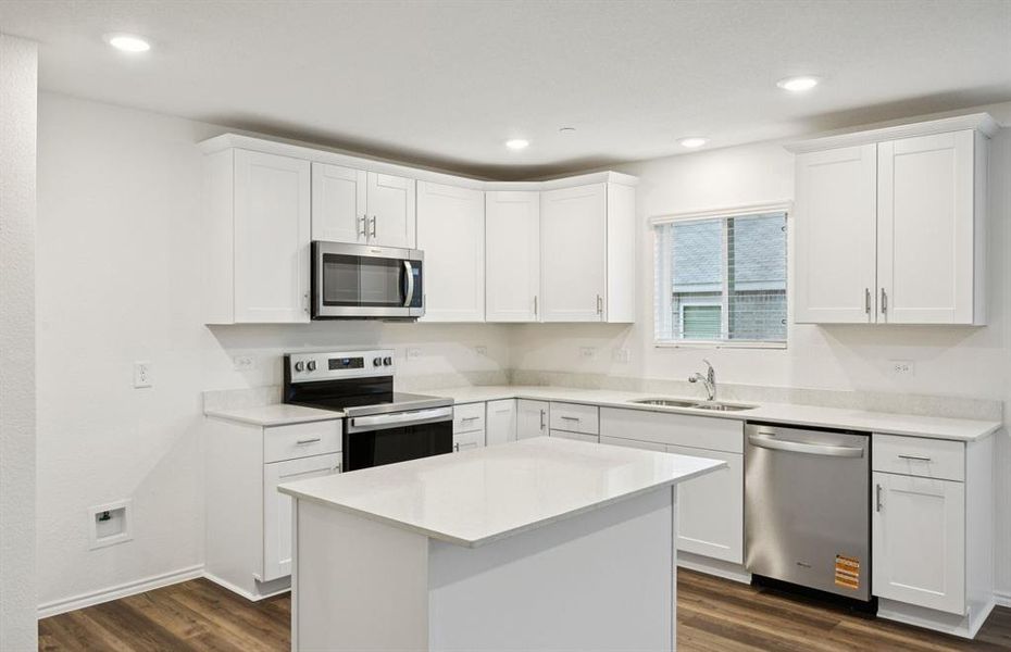 Spacious kitchen with eat-in bartop island Spacious kitchen with eat-in bartop island