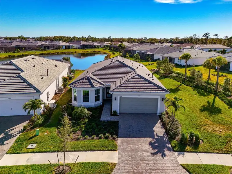 Front exterior of a new home in , Englewood, FL, highlighting curb appeal (Image 2). Front exterior of a new home in , Englewood, FL, highlighting curb appeal (Image 2).