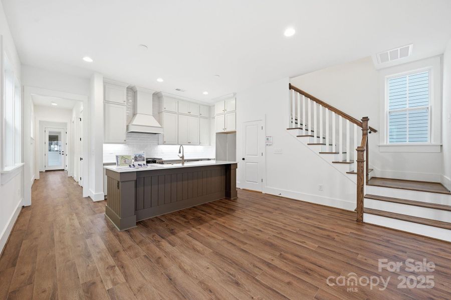 This spacious dining and kitchen area with 10-foot ceilings is perfect for gatherings. This spacious dining and kitchen area with 10-foot ceilings is perfect for gatherings.