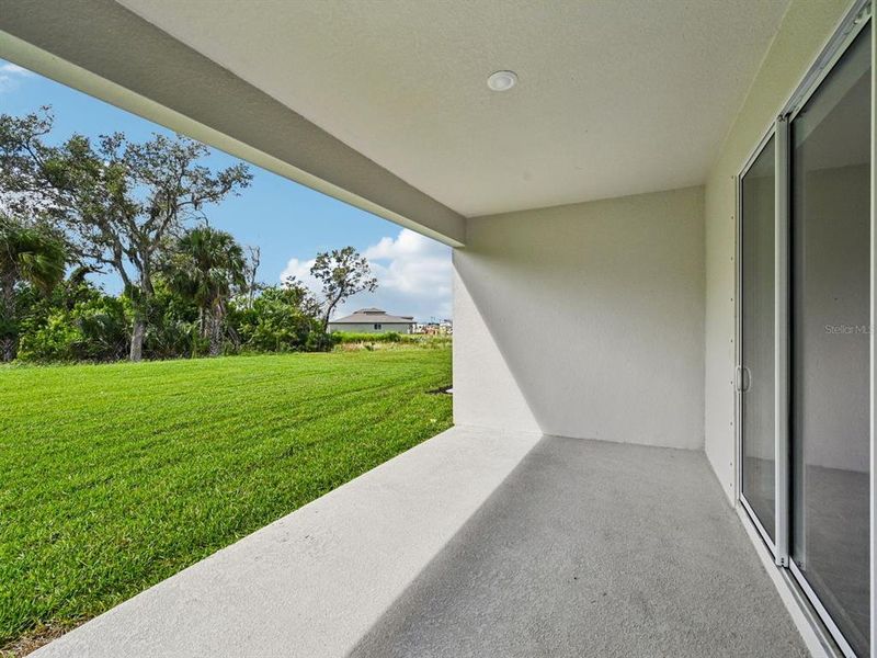 Exterior details and patio area of a home in Oakfield Trails - Signature Series, Parrish (Image 24).
