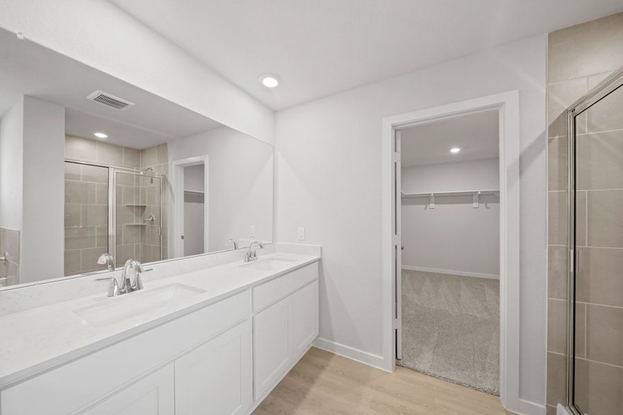 A bathroom with a glass shower.