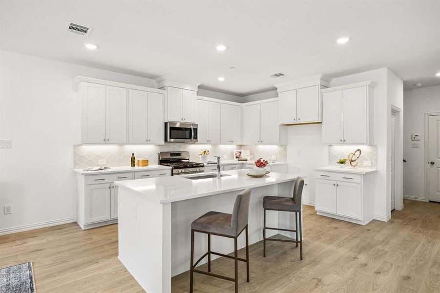 The spacious island offers the perfect place for friends and family to gather round!