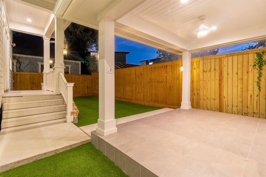 The covered patio already lives like a second outdoor living room, with room for seating, grilling, and dining. The covered patio already lives like a second outdoor living room, with room for seating, grilling, and dining.