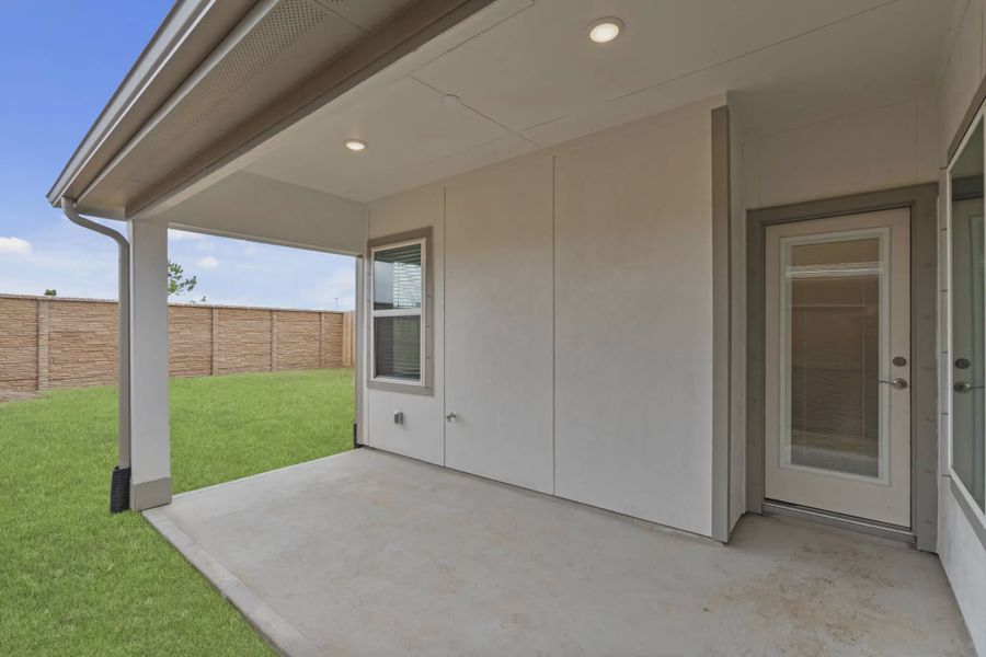 Representative exterior details of a home built from the Carriagehouse by Chesmar Homes in Meridiana Townhomes, Iowa Colony (Image 48).