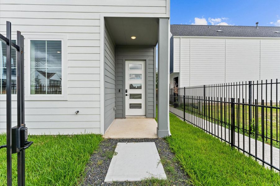 Welcome home! The front door facs the community courtyard. It has an iron gate that encloses the front and side yard. Welcome home! The front door facs the community courtyard. It has an iron gate that encloses the front and side yard.