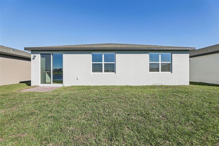 Exterior details and patio area of a home in Lake Deer Estates - Signature Series, Poinciana (Image 23).