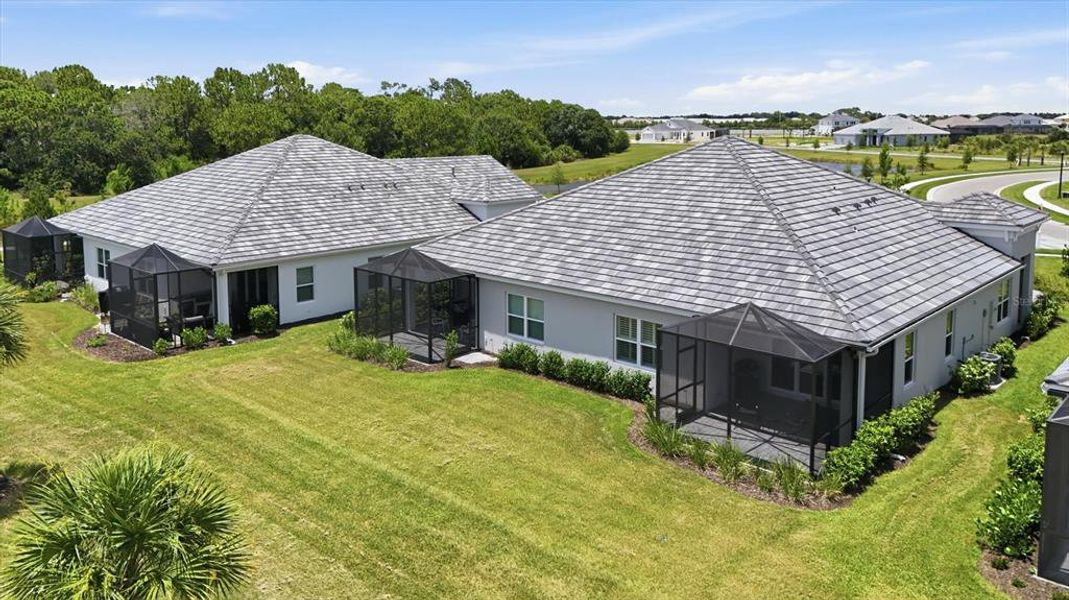 Front exterior of a new home in Windward, Lakewood Ranch, FL, highlighting curb appeal (Image 21). Front exterior of a new home in Windward, Lakewood Ranch, FL, highlighting curb appeal (Image 21).