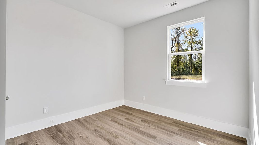 Representative unfurnished interior of a home built from the BRADFORD by D.R. Horton in Indigo Preserve, Leland (Image 17).