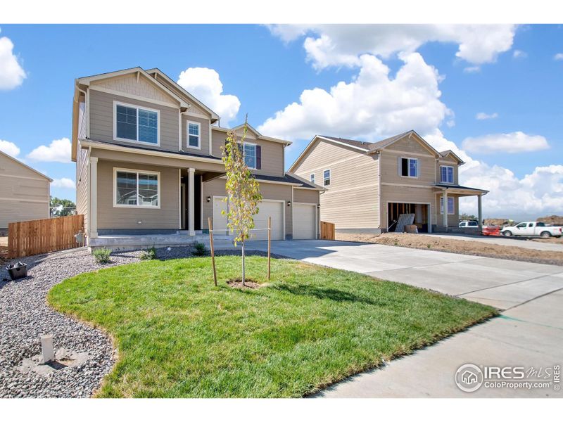 Front exterior of a new home in Northridge Estates, Greeley, CO, highlighting curb appeal (Image 17). Front exterior of a new home in Northridge Estates, Greeley, CO, highlighting curb appeal (Image 17).