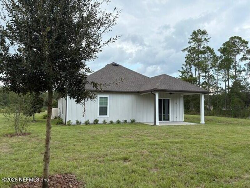 Exterior details and patio area of a home in Stables at Cary Forest, Bryceville (Image 3).