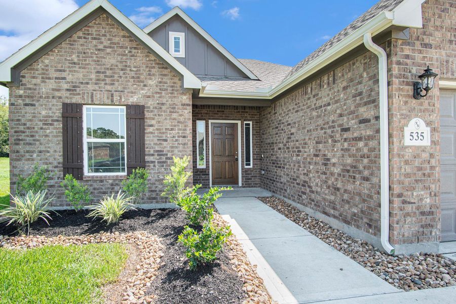 Front exterior of a new home in Columbia Lakes, West Columbia, TX, highlighting curb appeal (Image 18). Front exterior of a new home in Columbia Lakes, West Columbia, TX, highlighting curb appeal (Image 18).