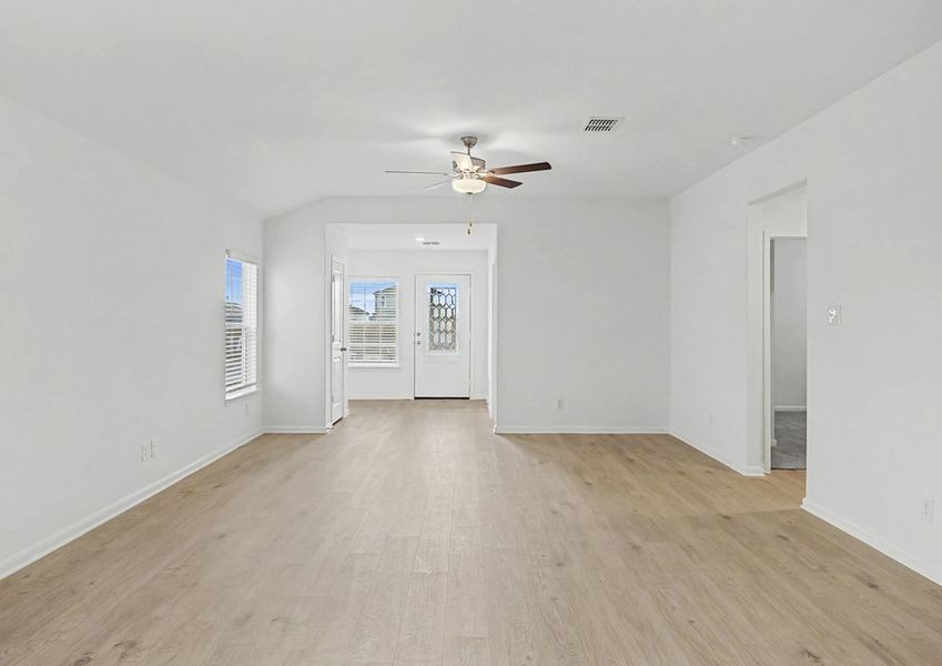 Spacious family room with a 3/4 lite front door