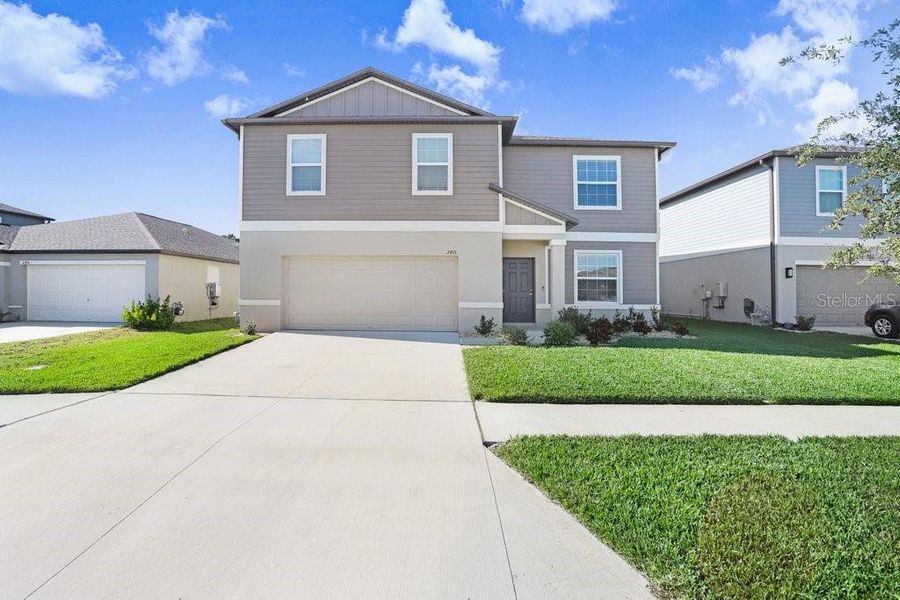 Front exterior of a new home in , Zephyrhills, FL, highlighting curb appeal (Image 25). Front exterior of a new home in , Zephyrhills, FL, highlighting curb appeal (Image 25).