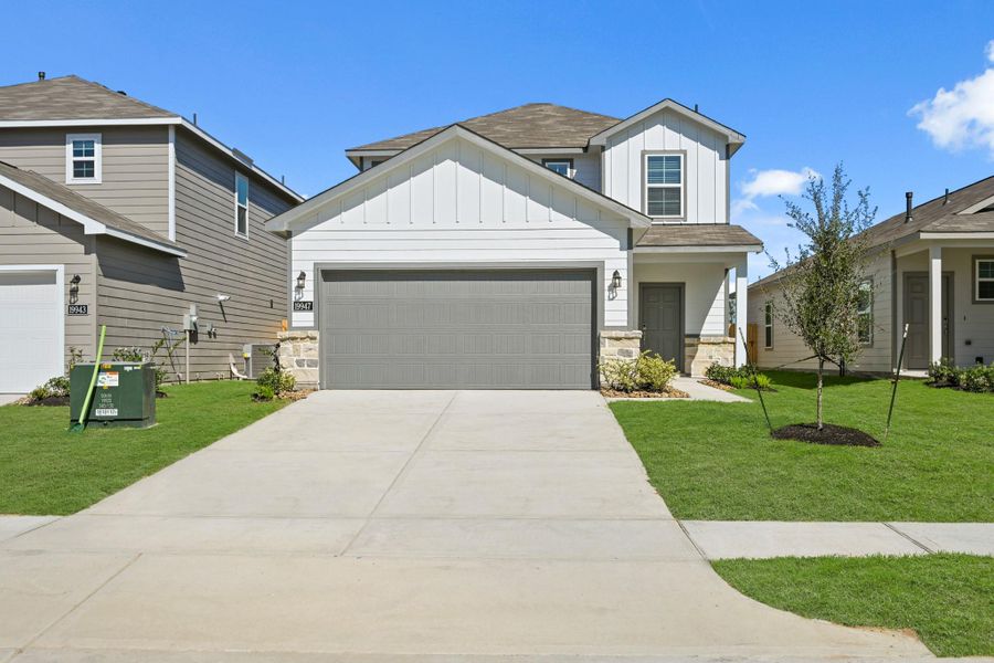 Front exterior of a new home in Northpark South, Porter, TX, highlighting curb appeal (Image 17). Front exterior of a new home in Northpark South, Porter, TX, highlighting curb appeal (Image 17).