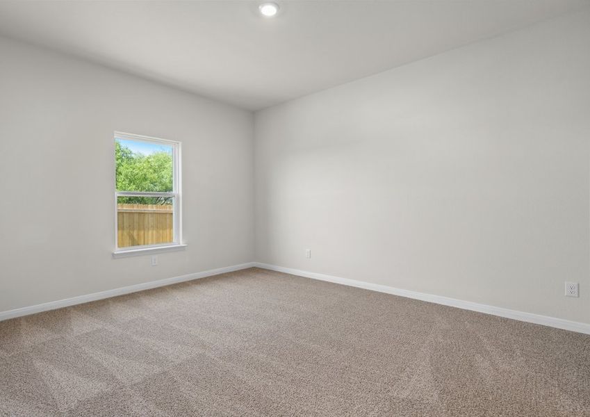 The master bedroom is spacious and has a large window.