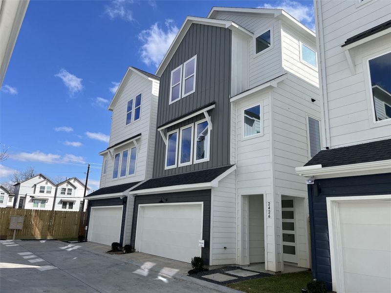The striking façade is 2426 Freeman St., one of the six homes in the community. It showcases a modern three-story design, offering 3 bedrooms, 3.5 bathrooms, and a dedicated study, with clean lines and contemporary architecture that reflect stylish urban living.