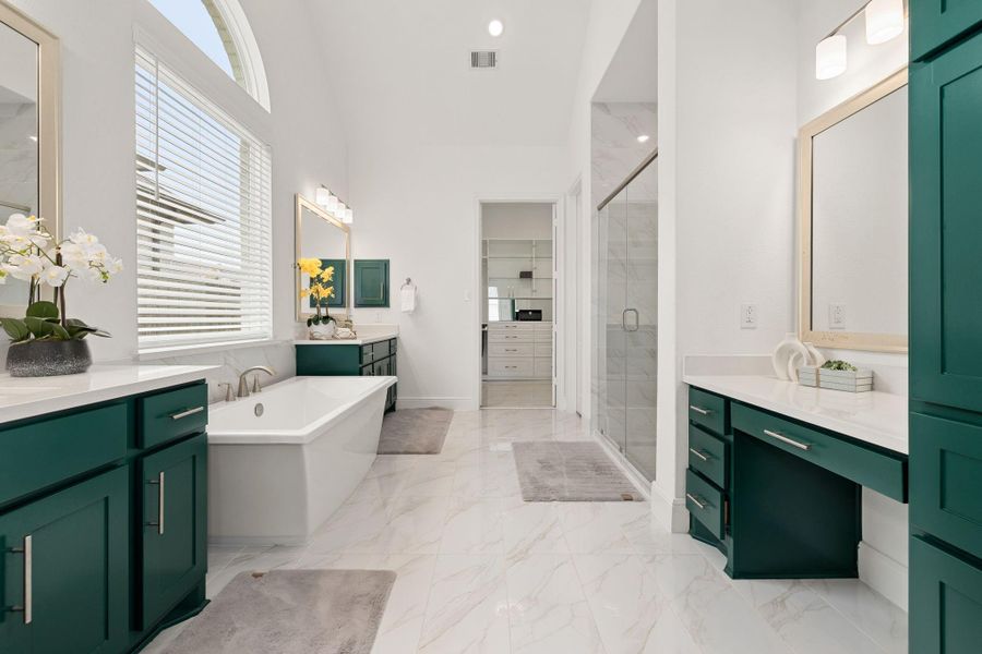 Stylish primary bathroom with dual vanities, rich cabinetry, and refined finishes.