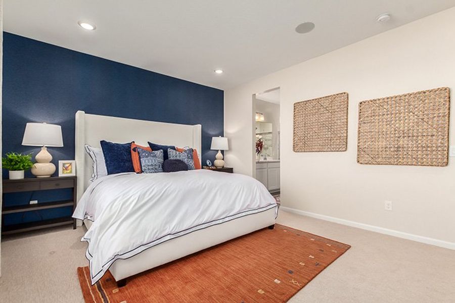 A bedroom with a bed and lamps. A bedroom with a bed and lamps.
