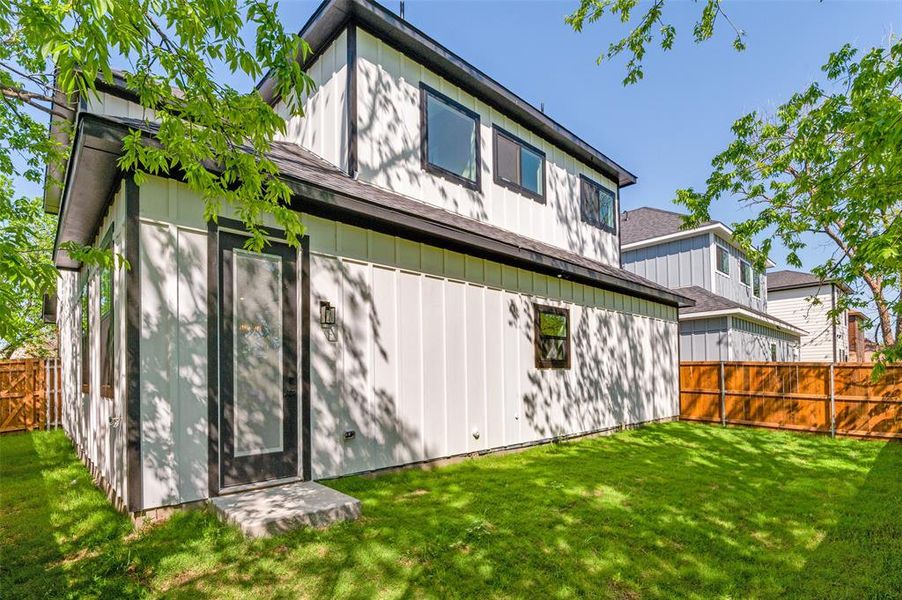 Rear view of house with board on board privacy fence and extra area to play in rear of home Rear view of house with board on board privacy fence and extra area to play in rear of home