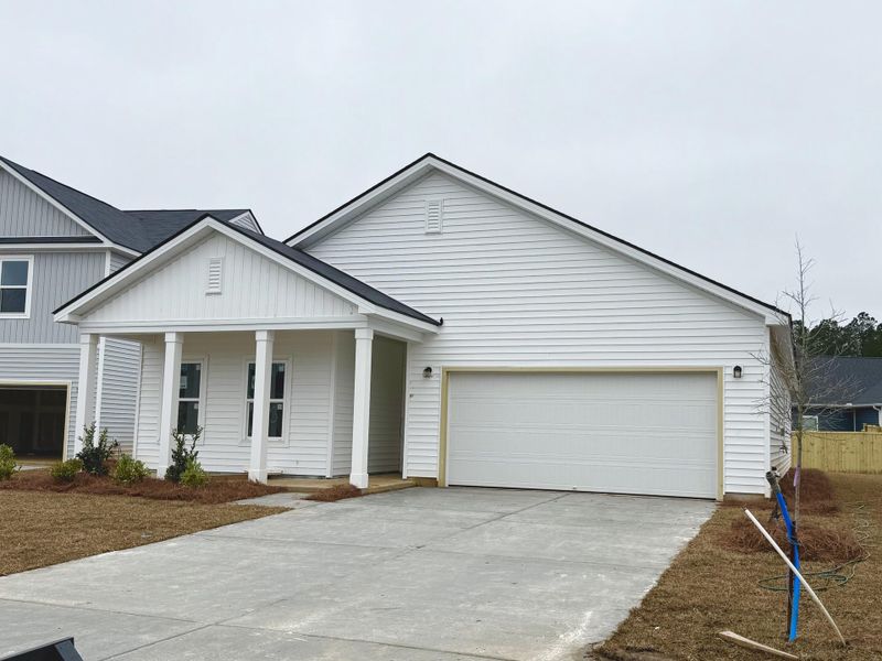Front exterior of a new home in Watson Hill, Summerville, SC, highlighting curb appeal (Image 18).