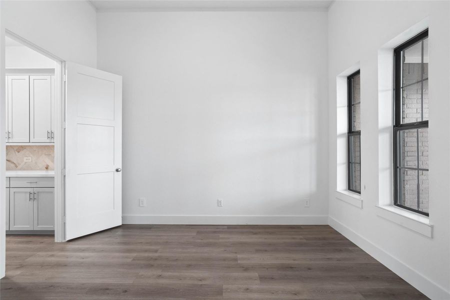 Additional view of study with access door to the Butler's Pantry and powder room.
