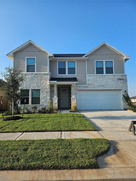 Front exterior of a new home in Laurel Landing, Alvin, TX, highlighting curb appeal (Image 16). Front exterior of a new home in Laurel Landing, Alvin, TX, highlighting curb appeal (Image 16).