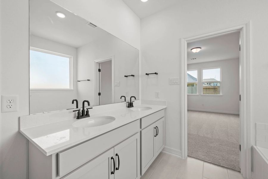 Primary bathroom. Sample product photo. Actual exterior and interior selections may vary by homesite. Photo may be virtually staged.