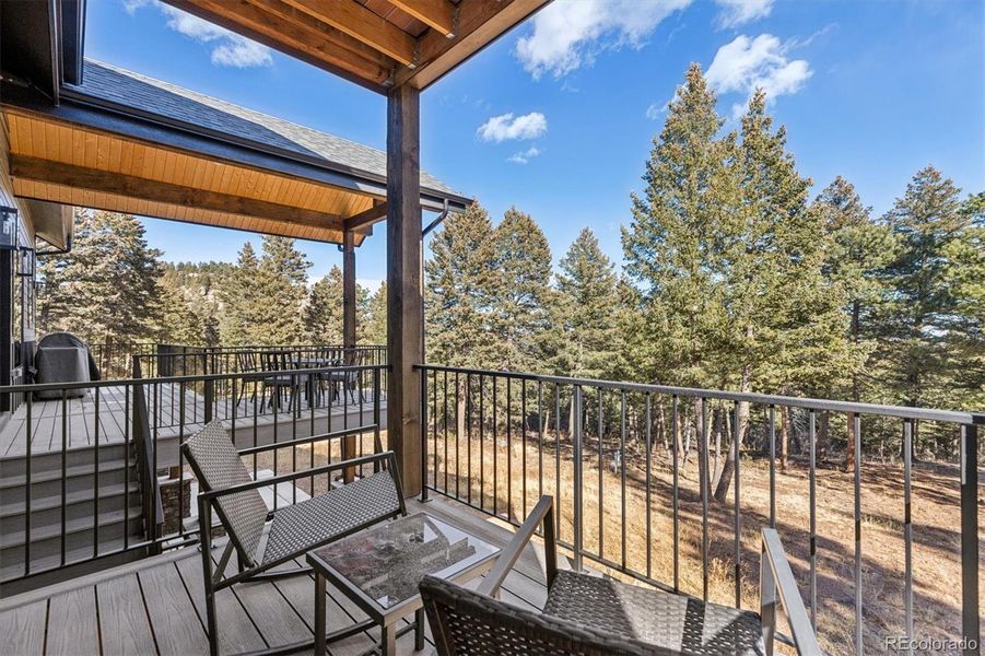 Covered deck off of the primary suite - private and serene views of majestic Ponderosa pines Covered deck off of the primary suite - private and serene views of majestic Ponderosa pines