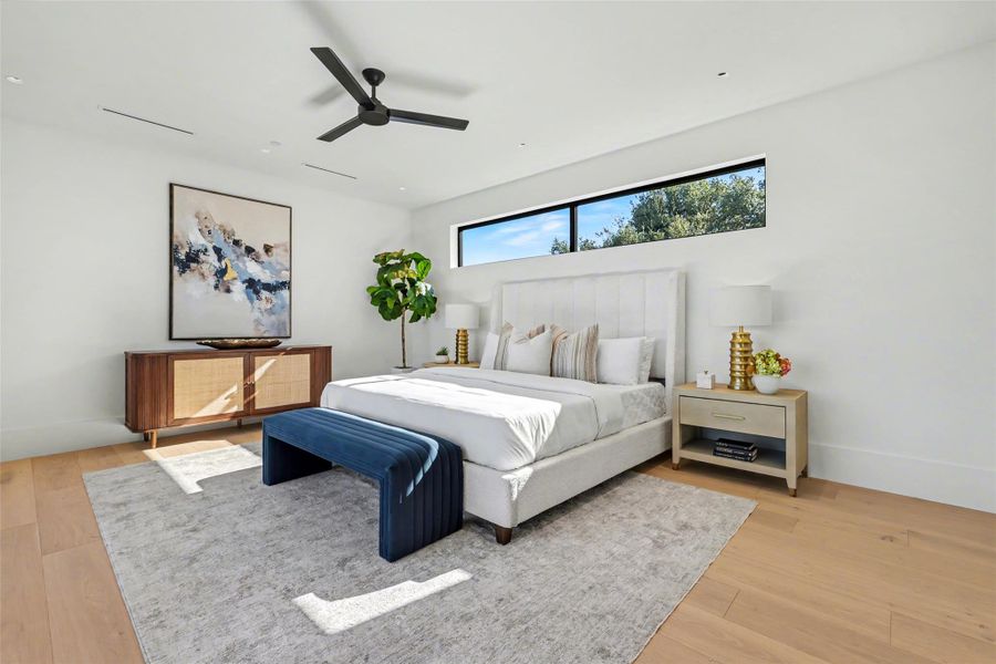 Bedroom featuring ceiling fan and light wood finished floors