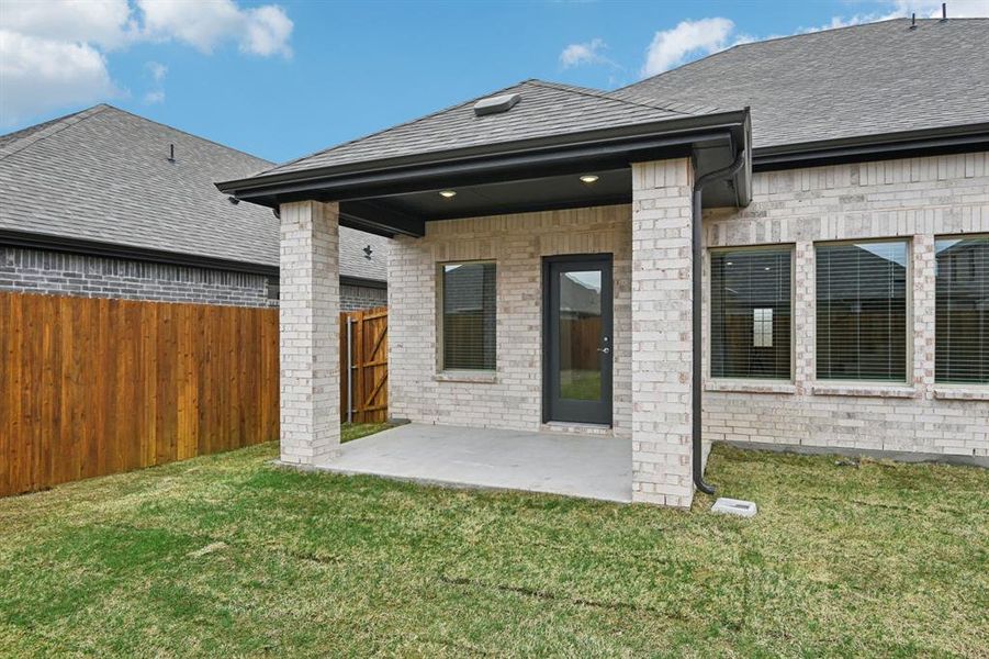 Exterior details and patio area of a home in Parks at Foster Crossing - Signature Series, Anna (Image 25).