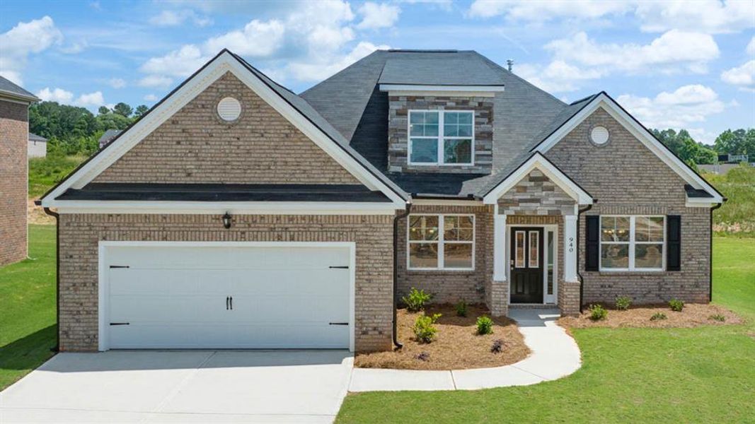 Front exterior of a new home in Evergreen Crossing, Locust Grove, GA, highlighting curb appeal (Image 2).