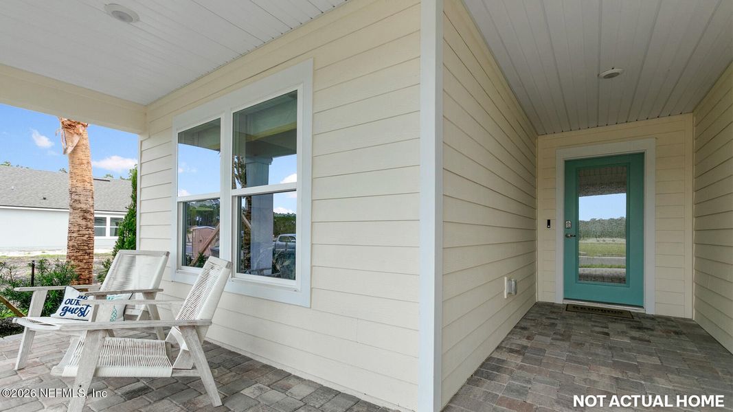 Exterior details and patio area of a home in American Village, Palm Coast (Image 2).
