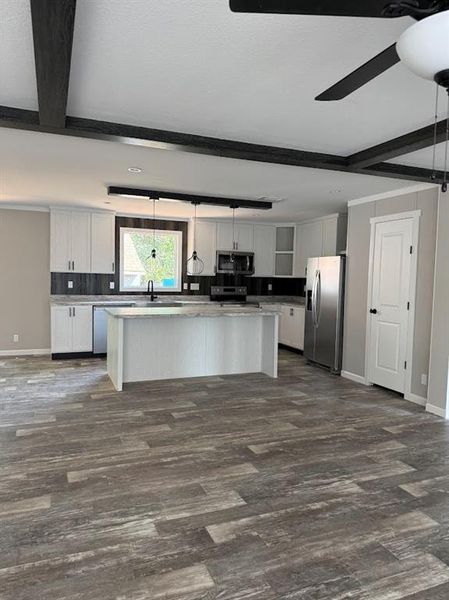 Furnished interior view inside a new home in , Pelican Bay (Image 3).