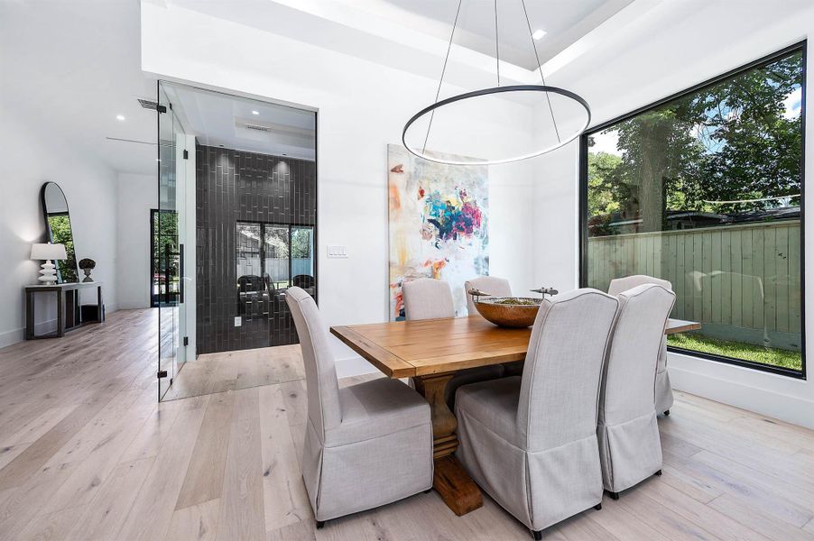 Sophisticated glass-enclosed wine room located just off the dining area, offering a stylish display for your collection and easy access for entertaining.