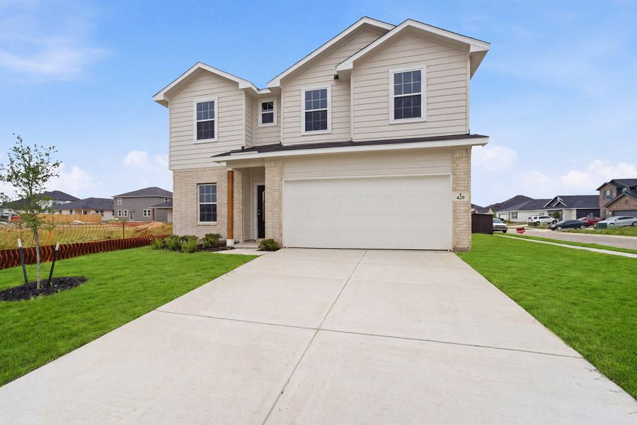 Front exterior of a new home in Hannah Heights, Seguin, TX, highlighting curb appeal (Image 2). Front exterior of a new home in Hannah Heights, Seguin, TX, highlighting curb appeal (Image 2).