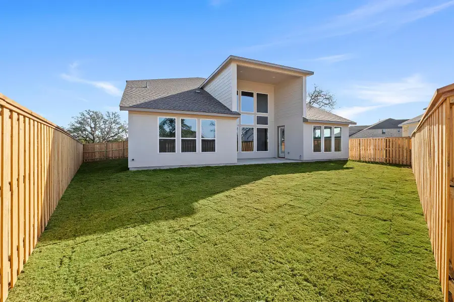 Exterior details and patio area of a home in Parmer Ranch, Georgetown (Image 25).