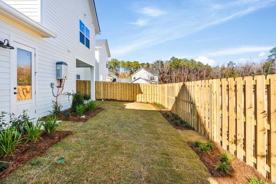 Exterior details and patio area of a home in , Johns Island (Image 35).