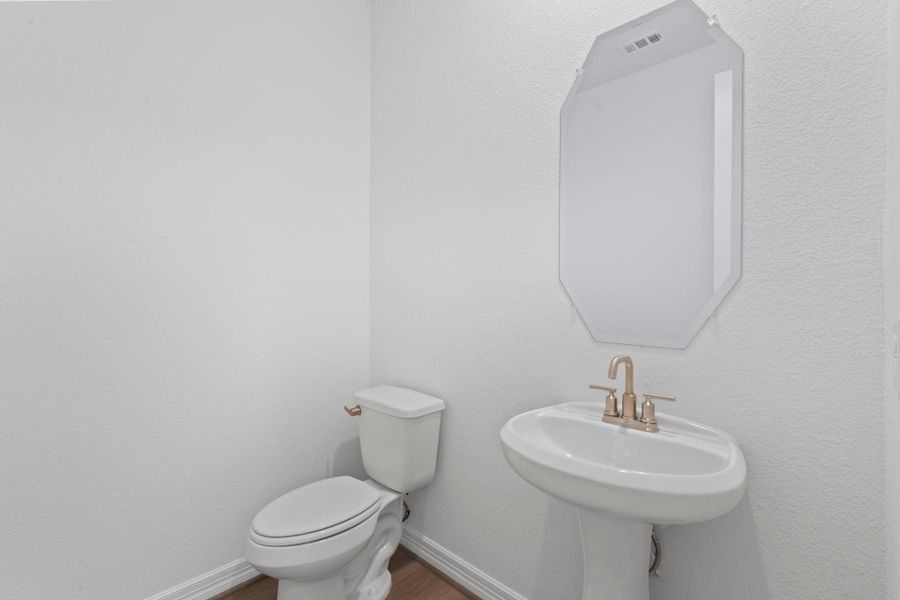 This charming home features a beautifully appointed half bath adjacent to the family room, perfect for welcoming guests and adding convenience to your daily life. This charming home features a beautifully appointed half bath adjacent to the family room, perfect for welcoming guests and adding convenience to your daily life.