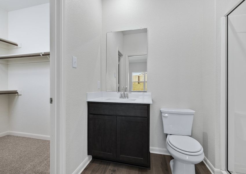 The walk-in closet sits right off of the master bathroom.