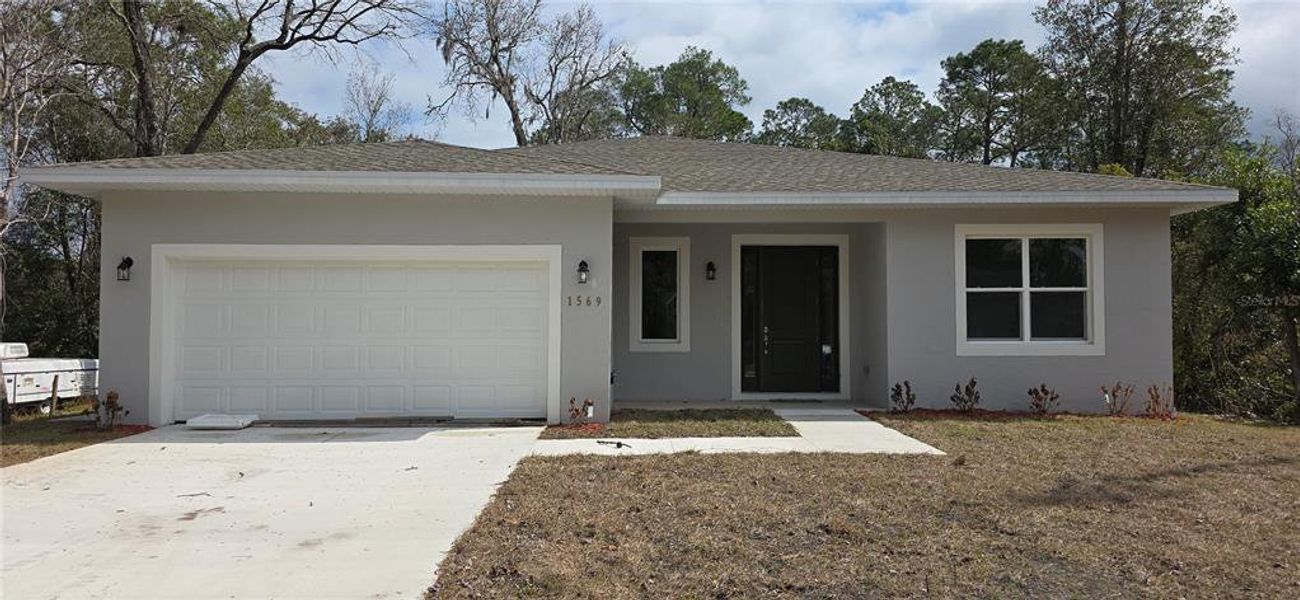 Front exterior of a new home in , Deland, FL, highlighting curb appeal (Image 22). Front exterior of a new home in , Deland, FL, highlighting curb appeal (Image 22).