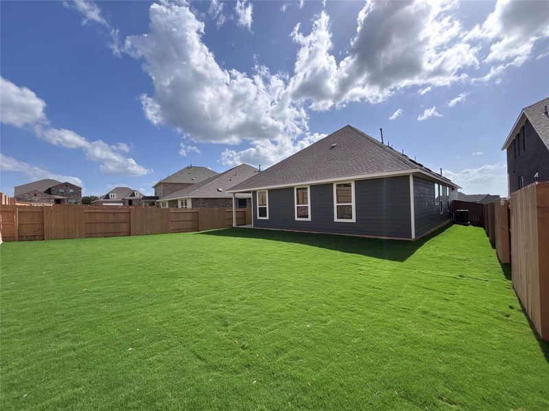 Front exterior of a new home in The Colony 50s, Cedar Creek, TX, highlighting curb appeal (Image 15).