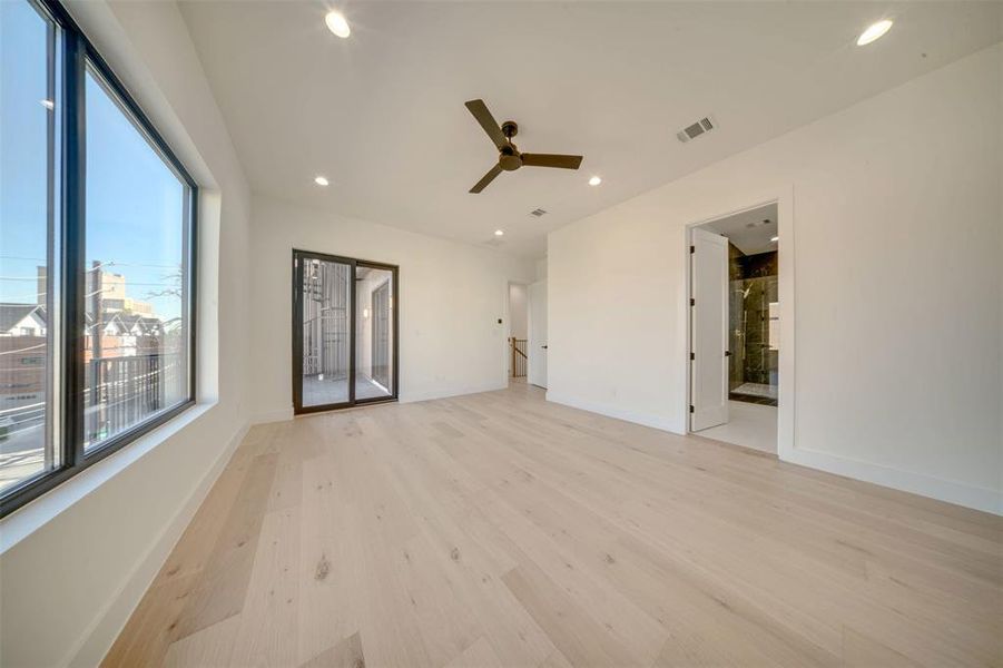 Spare room with ceiling fan and light hardwood / wood-style floors