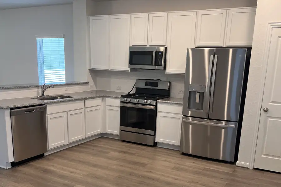 Furnished interior view inside a new home in Hunter's Ranch, San Antonio (Image 4).