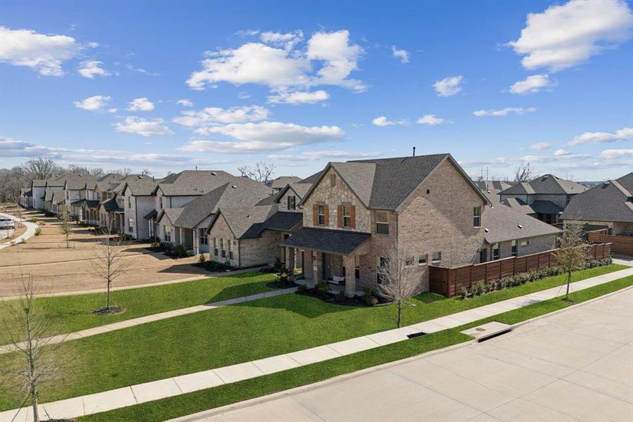 Front exterior of a new home in Solterra, Mesquite, TX, highlighting curb appeal (Image 19). Front exterior of a new home in Solterra, Mesquite, TX, highlighting curb appeal (Image 19).