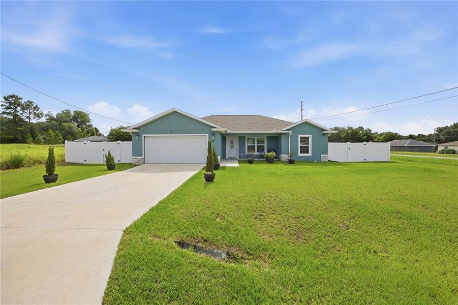 Front exterior of a new home in , Ocala, FL, highlighting curb appeal (Image 22). Front exterior of a new home in , Ocala, FL, highlighting curb appeal (Image 22).