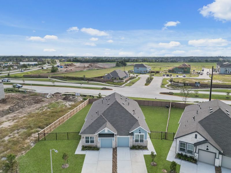 Representative exterior photo of a completed home built from the Chalet by Chesmar Homes in Meridiana Townhomes, Iowa Colony, TX (Image 27).