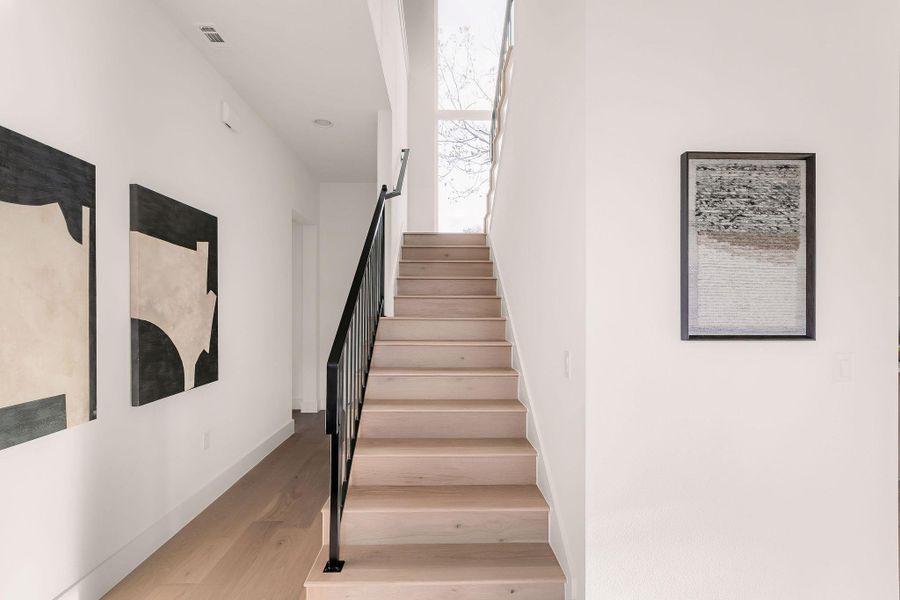 Stairs with wood finished floors and baseboards Stairs with wood finished floors and baseboards