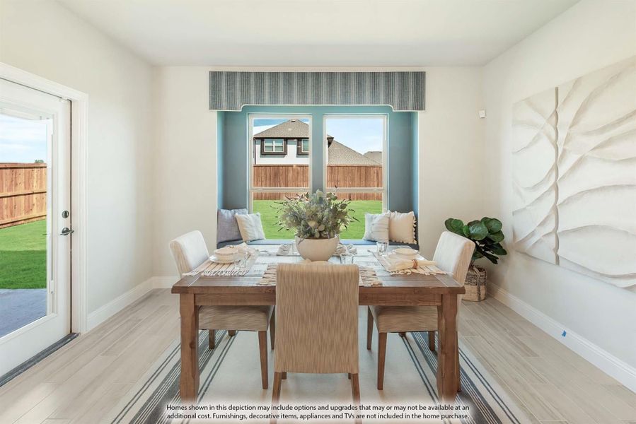 Dining room with wood table, upholstered chairs, window seat, and backyard view through large window Dining room with wood table, upholstered chairs, window seat, and backyard view through large window