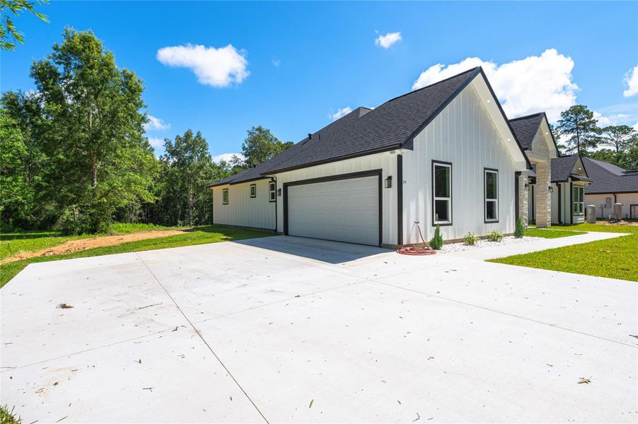 Front exterior of a new home in , Dayton, TX, highlighting curb appeal (Image 29).